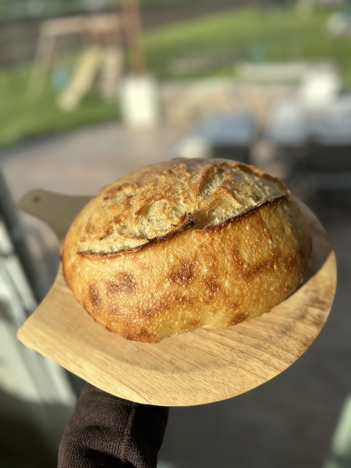 Country sourdough boule on a marble counter